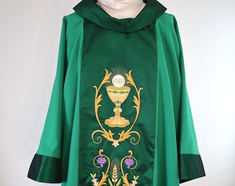 May include: Green liturgical vestment with gold embroidery of a chalice and host, with the inscription "JHS" on the host.