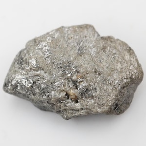 May include: A rough, gray, metallic rock with a crystalline texture.