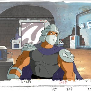 May include: An animated image of Shredder from Teenage Mutant Ninja Turtles. He is wearing a silver helmet, mask, and shoulder armor, with a purple cape. The background shows a tech-filled room with a computer screen and other equipment.
