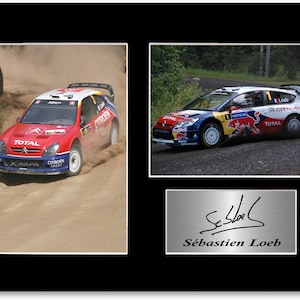 May include: Framed print featuring two action shots of a Citroën rally car, one in red and the other in blue, with the signature of Sébastien Loeb below. The cars are racing on dirt and gravel.