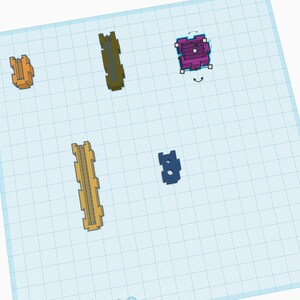 Puede incluir: Surtido de pequeñas piezas de plástico en varios colores, incluyendo amarillo, naranja, morado y azul. Las piezas están dispuestas sobre un fondo de cuadrícula.