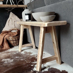 May include: A rustic wooden sign with the text "Welcome to our home" in a handwritten style. The sign has a distressed finish and a simple, inviting design, suitable for a front porch or entryway.