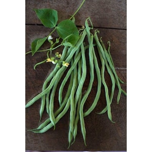 May include: A collection of fresh, green string beans with attached leaves and small yellow flowers. The beans are arranged on a dark brown wooden surface, showcasing their vibrant color and natural texture. The image highlights the freshness of the produce.