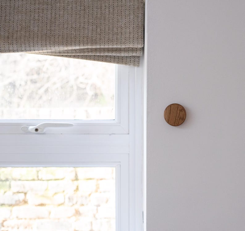 oak wooden key holder next to window