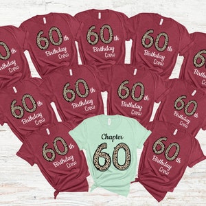 May include: Nine maroon t-shirts with the text "60th Birthday Crew" in white with a leopard print 60. One light green t-shirt with the text "Chapter 60" in white with a leopard print 60.