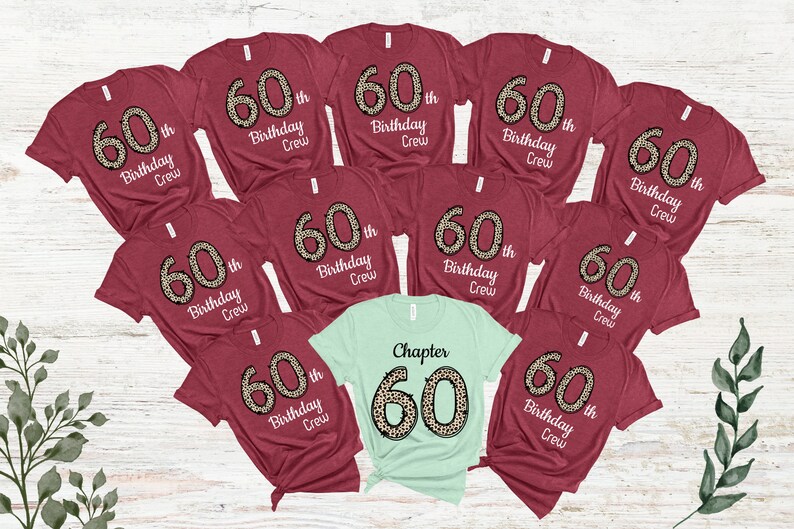 May include: Nine maroon t-shirts with the text "60th Birthday Crew" in white with a leopard print 60. One light green t-shirt with the text "Chapter 60" in white with a leopard print 60.