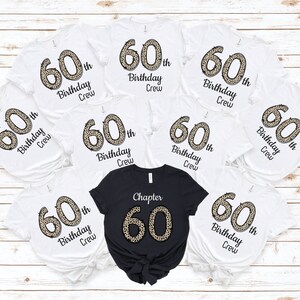 May include: Eight white t-shirts with a leopard print 60th birthday design and the text "60th Birthday Crew". One black t-shirt with a leopard print 60 and the text "Chapter 60".