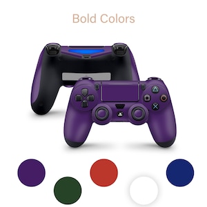 May include: Purple PlayStation 4 controller with the words "Bold Colors" above it. Five color swatches are shown below the controller: purple, dark green, red, white, and blue.