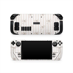 May include: A white and beige striped skin for a handheld gaming device, adorned with a pattern of bows. The device has black control buttons and a black screen. The word "STEAM" is visible on the device.