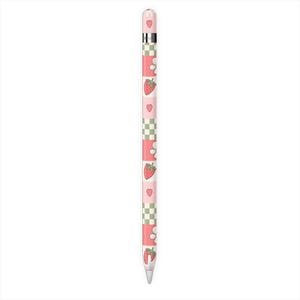 May include: A pink and white patterned stylus with a strawberry and heart design. The stylus has a silver metal band and a white tip. The design includes strawberries, hearts, and a checkered pattern.