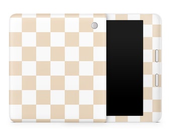May include: A white tablet with a beige checkered pattern on the back and front. The tablet has a black screen.