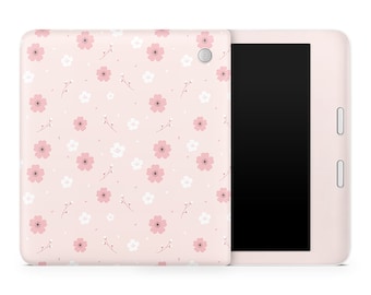 May include: A pink tablet case with a white and pink floral pattern. The case is shown closed with the tablet screen facing the viewer.