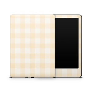 May include: A white and yellow gingham pattern e-reader cover with a black screen.
