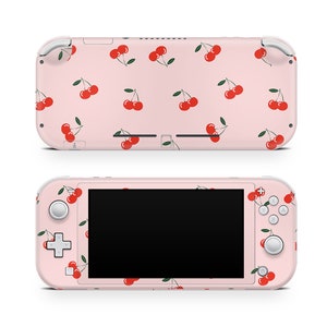 May include: Pink Nintendo Switch Lite console with a cherry pattern skin. The console has a black screen and white buttons.