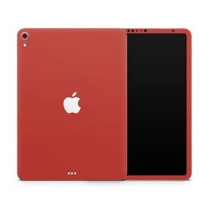 Può includere: Un iPad rosso con un logo Apple bianco sul retro. L'iPad è mostrato in vista frontale e posteriore.