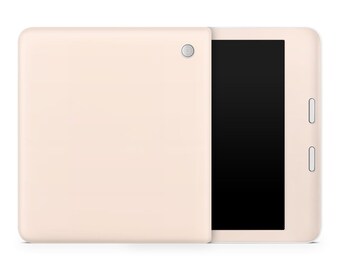 May include: A cream-colored tablet computer with a black screen and a camera on the back. The tablet is closed and lying on a white surface.