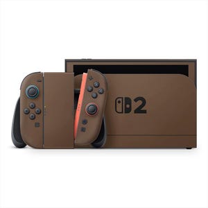 May include: A brown Nintendo Switch console with matching Joy-Con controllers. The controllers have blue and red accents. The console has the text "2" on the front.