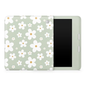 May include: A green tablet case featuring a white daisy pattern. The case is designed to fit a tablet with a screen size of 7-8 inches.