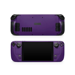 May include: A purple handheld gaming device with a black screen, buttons, and joysticks. The device has the word "STEAM" printed on the side.
