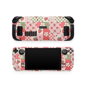 May include: Two views of a handheld gaming console with a strawberry patchwork design. The design features strawberries, flowers, and hearts on a pink, green, and white background. The console has black control buttons and a black screen.