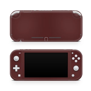 May include: A burgundy Nintendo Switch Lite handheld gaming console with white buttons and a black screen.