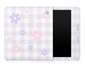 May include: A white tablet case with a purple and white gingham pattern and pink and purple flowers. The case has a black screen and a camera lens.