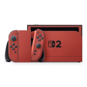Könnte beinhalten: Eine rote Nintendo Switch-Konsole mit abnehmbaren Joy-Con-Controllern. Konsole und Controller sind einfarbig rot. Der Text "d2" ist schwarz auf der Konsole aufgedruckt.