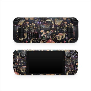 May include: Black handheld gaming device skin with a floral and butterfly design. The skin features a dark background with colorful flowers, mushrooms, and gold accents. The device has black control buttons and a screen.