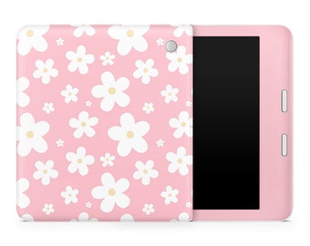 May include: A pink tablet case with a white daisy pattern. The case is shown closed with the screen facing the viewer.