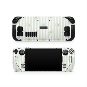 May include: Two Steam Deck gaming consoles, one above the other, showcasing a custom skin. The skin features a pattern of light green bows and vertical stripes on a white background. The consoles are black and white.