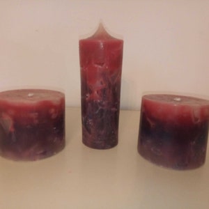 large pillar candles in purple and pink
