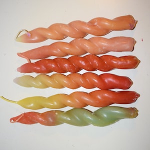 twisted table candles, stick candles, twisted candles in red orange green yellow