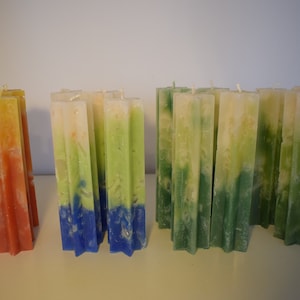 Advent candles in a tall (20 cm) star shape, star candles in yellow red orange and blue green white and green white