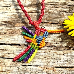 Colorful macramé hummingbird necklace with turquoise and colored glass.