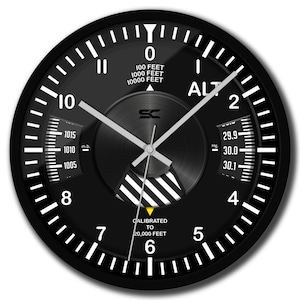 May include: Black aviation-themed wall clock with white numerals and hands. The clock face features altitude and pressure indicators, with text including "ALT" and "CALIBRATED TO 20,000 FEET". The clock has a round shape.
