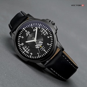 May include: Black analog watch with a leather band. The watch face features white markings and hands against a black background, with the text "ALT" and "CALIBRATED TO 20,000 FEET". The watch has a black case and a black leather strap with white stitching. The brand name "VECTOR S" is visible.