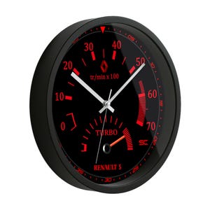 May include: Black wall clock with a red and black gauge design. The clock face features a speedometer-style display with the text "TURBO" and "RENAULT 5". The clock hands are white.