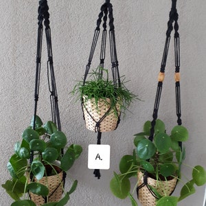 May include: Three black macrame plant hangers with wooden beads. Each hanger holds a potted plant. The plants are labeled A, B, and C.
