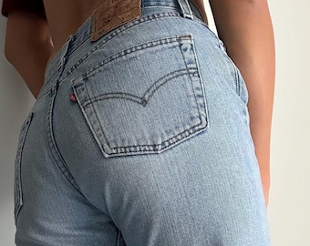 W29 Vintage Levi's 501 light blue wash 90s jeans women y2k collection