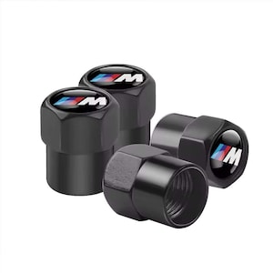 May include: Four black tyre valve stem caps. Each cap has a glossy finish and a circular emblem with the BMW logo in blue, white, and red, with the letter "M" in white. Designed to fit standard tyre valves.