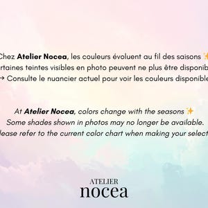 May include: A pastel-colored background with text in French and English. The text states that colors change with the seasons and some shades may no longer be available. The Atelier Nocea logo is at the bottom.