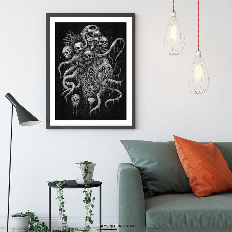 May include: Framed black and white art print. The artwork depicts a creature composed of skulls and tentacles, with a dark, gothic aesthetic. The illustration has intricate linework and a textured background. The print is displayed in a black frame, suitable for a home decor.