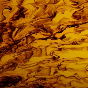 May include: Abstract art print featuring swirling patterns in shades of brown and yellow.