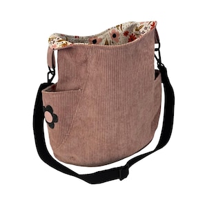 May include: A rustic wooden sign with the text "Welcome to our home" in white lettering. The sign features a distressed finish and a simple, inviting design, perfect for front door decor.