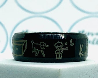 Anillo negro con banda de dibujos animados