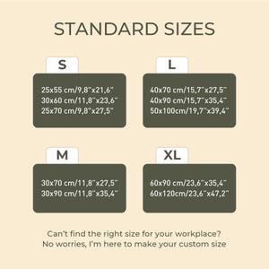 May include: A chart showing standard sizes for a product, with measurements in inches and centimeters. The sizes are S, M, L, and XL. The chart is on a light beige background with green text.