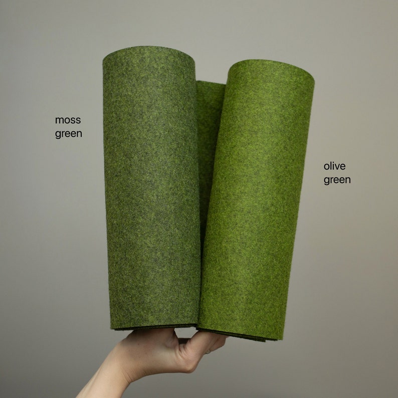 May include: Two rolls of felt fabric, one in moss green and one in olive green.