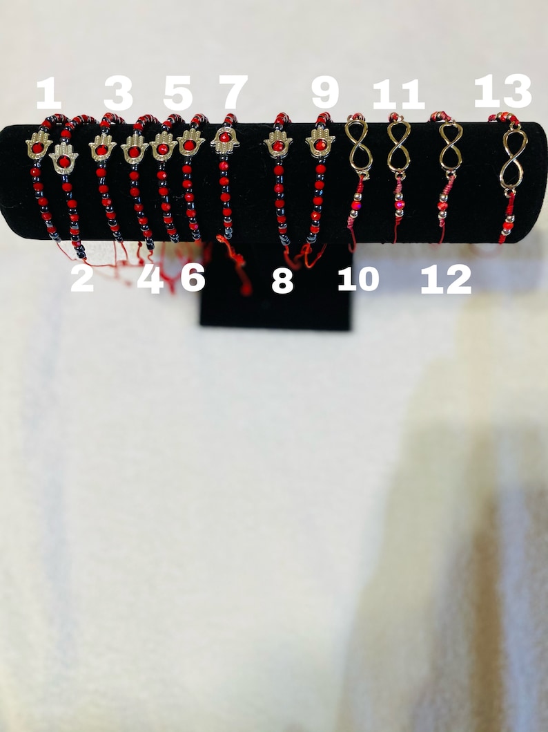 Red And Black Bracelets With Charms