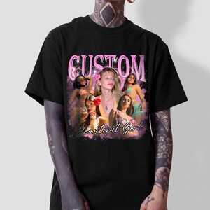 May include: Black t-shirt with a pink graphic design featuring the word "CUSTOM" and the phrase "Beautiful Girl". The graphic also includes a collage of images of women.
