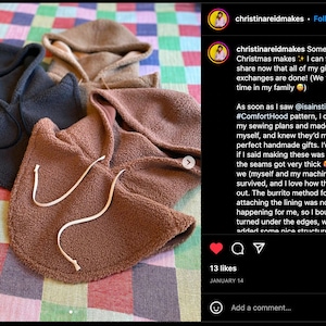 May include: Three fleece hooded tops in brown, black and beige. The tops are laid out on a checkered fabric. The caption reads: "Some belated Christmas makes + I can finally share now that all of my gift exchanges are done! (We take our time in my family 😉) As soon as I saw @isainstitches #ComfortHood pattern, I dropped my sewing plans and made one for myself, and knew they'd make perfect handmade gifts. I'd be lying if I said making these was *all* fun - the seams got very thick 🤪 - but we (myself and my machines) survived, and I love how they turned out. The burrito method for attaching the lining was not happening for me, so I bound and turned under the edges, which added some nice structure"